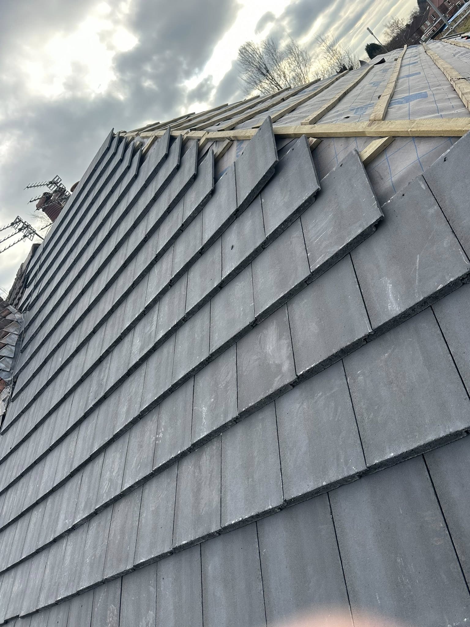 Close-up of slate tile roof installation with modern design