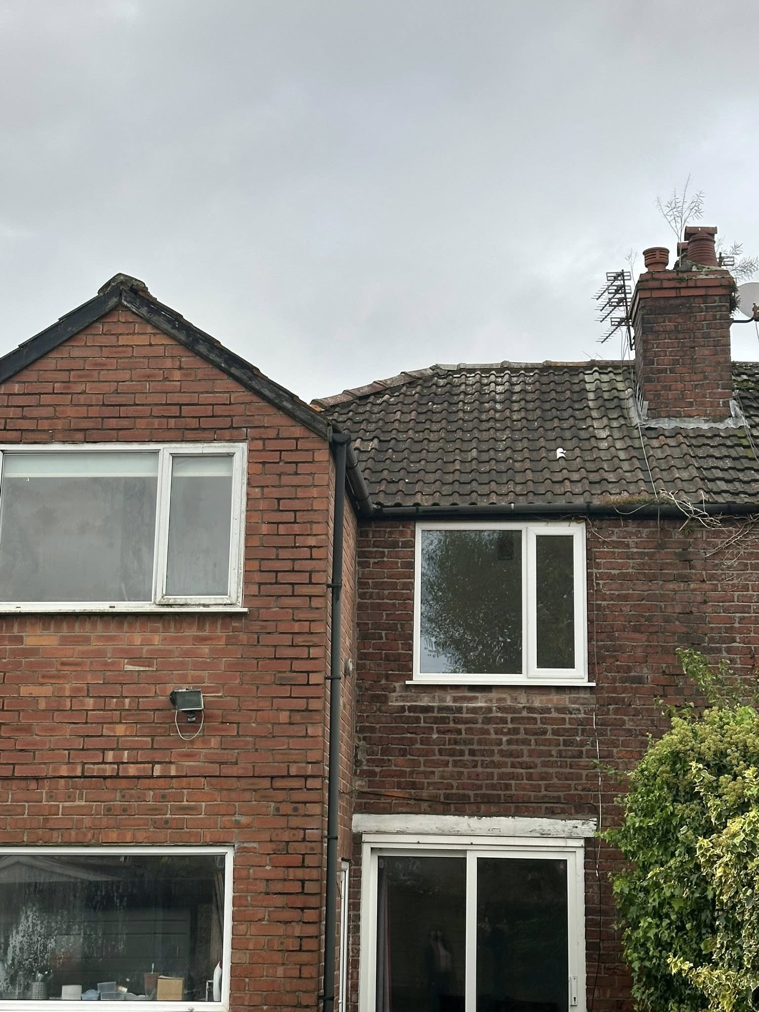 Brick residential property exterior with pitched roof