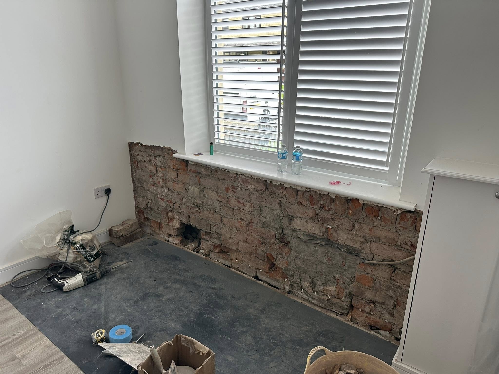 Exposed brickwork prepared for plastering and restoration